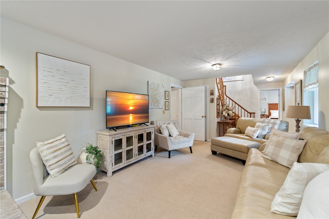 5817 East Henrietta Road Rush, NY 14543 - Photo 11 of 47 The lower level living area has a fireplace, a fit