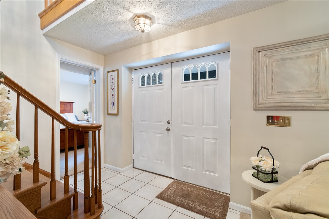 5817 East Henrietta Road Rush, NY 14543 - Photo 7 of 47 The entryway from the front- beautifully tiled flo