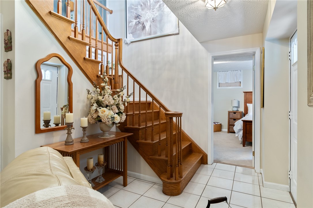 5817 East Henrietta Road Rush, NY 14543 - Photo 8 of 47 The entryway opens to the living room and the FIRS