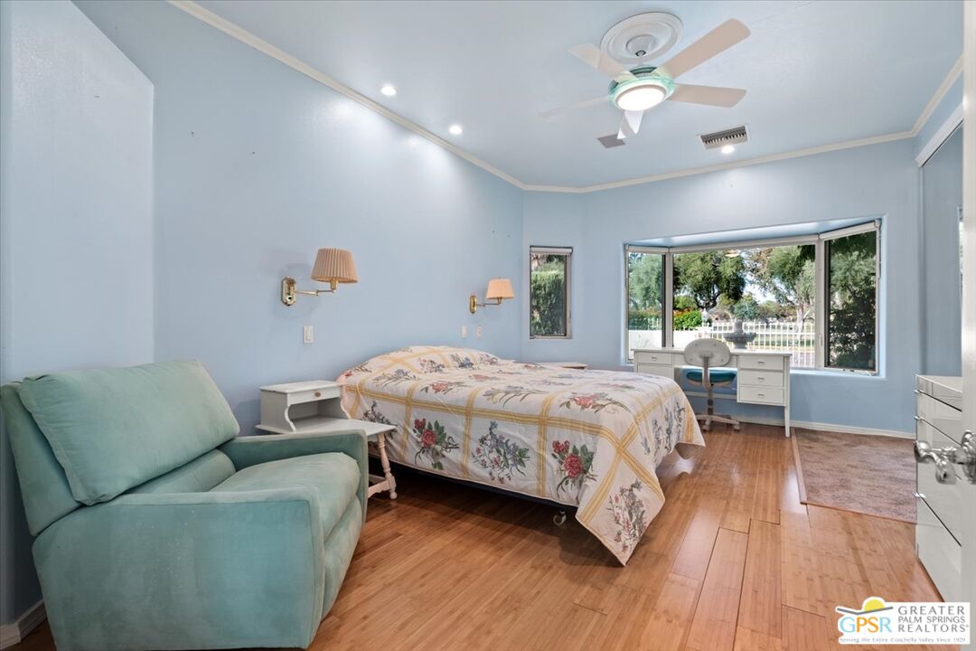 875 Tamarisk Road Palm Springs, CA 92262 - Photo 21 of 55 a bedroom with a bed couch and a window