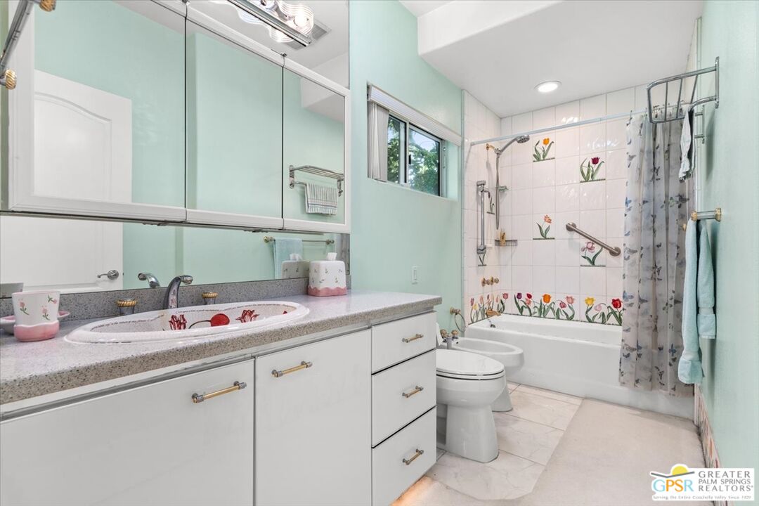 875 Tamarisk Road Palm Springs, CA 92262 - Photo 23 of 55 a bathroom with a sink toilet and shower