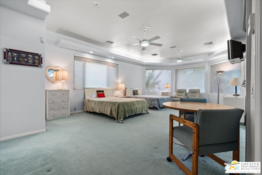 875 Tamarisk Road Palm Springs, CA 92262 - Photo 34 of 55 a bed room with a bed and a window