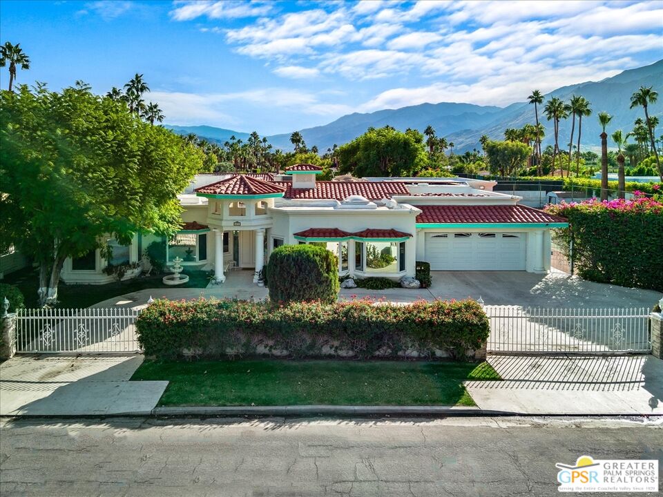 875 Tamarisk Road Palm Springs, CA 92262 - Photo 52 of 55 a front view of a house with a garden