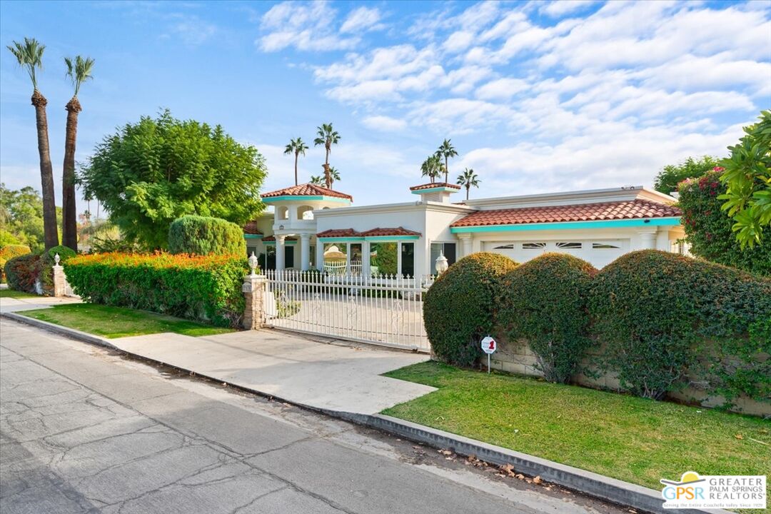 875 Tamarisk Road Palm Springs, CA 92262 - Photo 53 of 55 a front view of a house with a yard