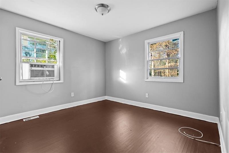 685 Bolton Road Northwest Atlanta, GA 30331 - Photo 10 of 21 a view of a room with wooden floor and windows