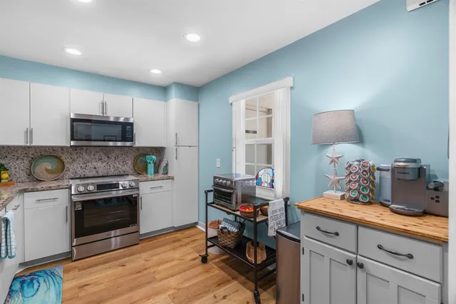 a kitchen with a sink cabinets and stainless steel appliances