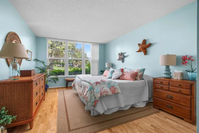 a bed room with a bed and a window