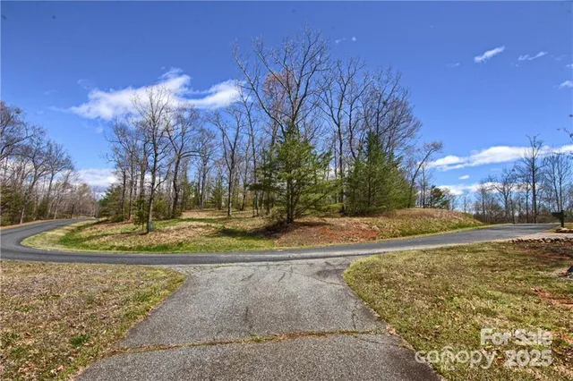 a view of a fountain in front of a house