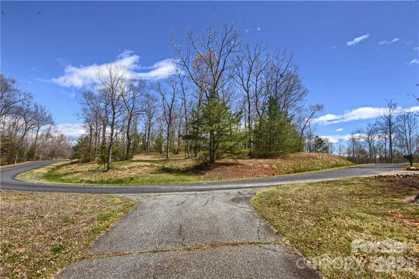 a view of a fountain in front of a house