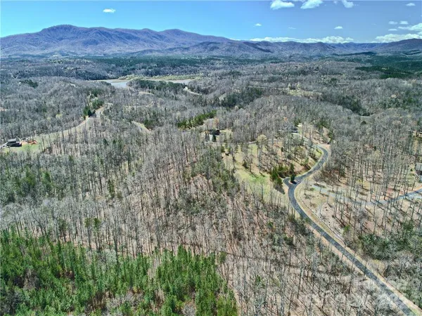 a view of a backyard of a house with a mountain