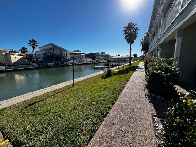 2290 North Fulton Beach Road, Unit B317 Rockport, TX 78382 - Photo 34 of 40 a view of a garden with a pond