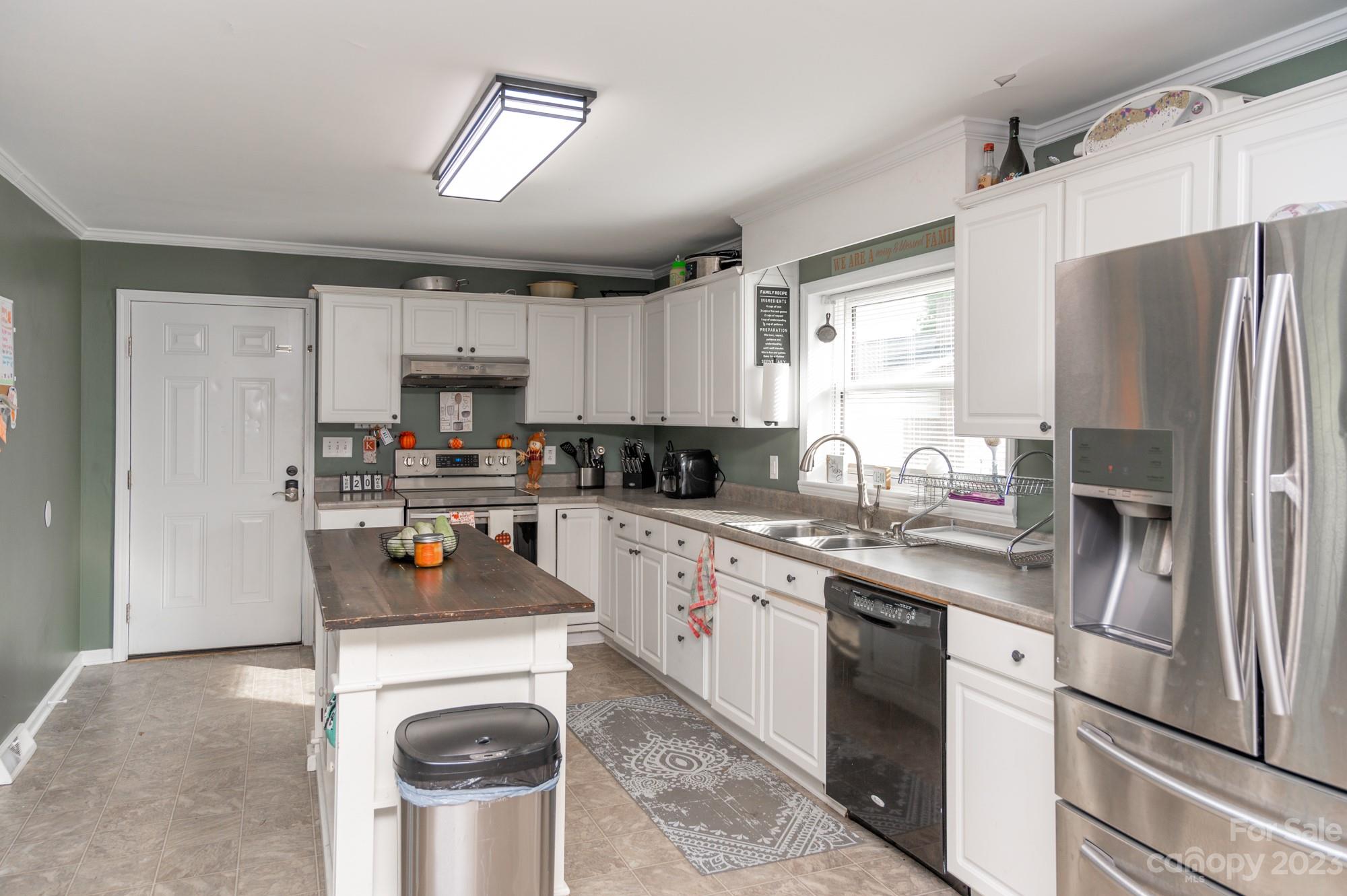 6600 Barrier Store Road Mount Pleasant, NC 28124 - Photo 18 of 21 a kitchen with stainless steel appliances a refrigerator sink and cabinets