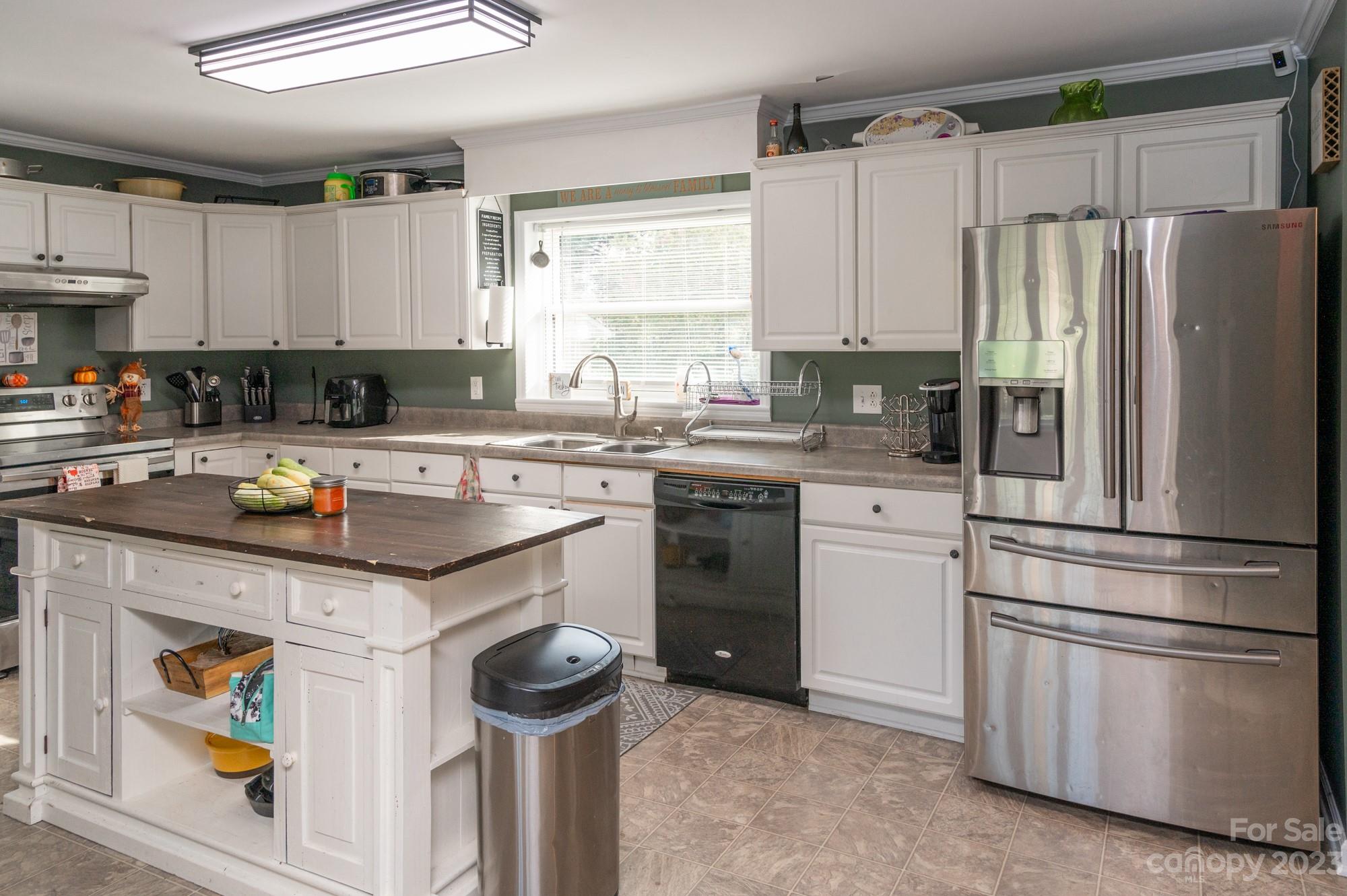 6600 Barrier Store Road Mount Pleasant, NC 28124 - Photo 6 of 21 a kitchen with a sink a stove a refrigerator and cabinets
