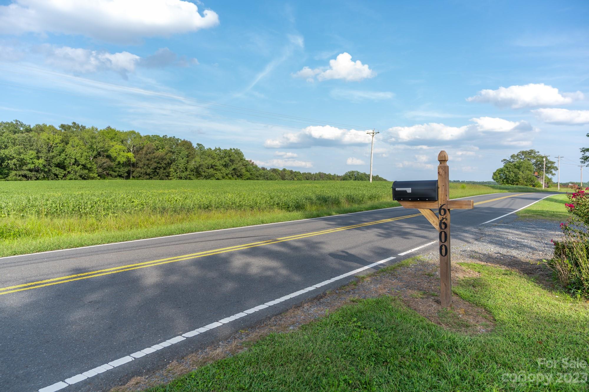 6600 Barrier Store Road Mount Pleasant, NC 28124 - Photo 10 of 21 a view of a lake with a big yard