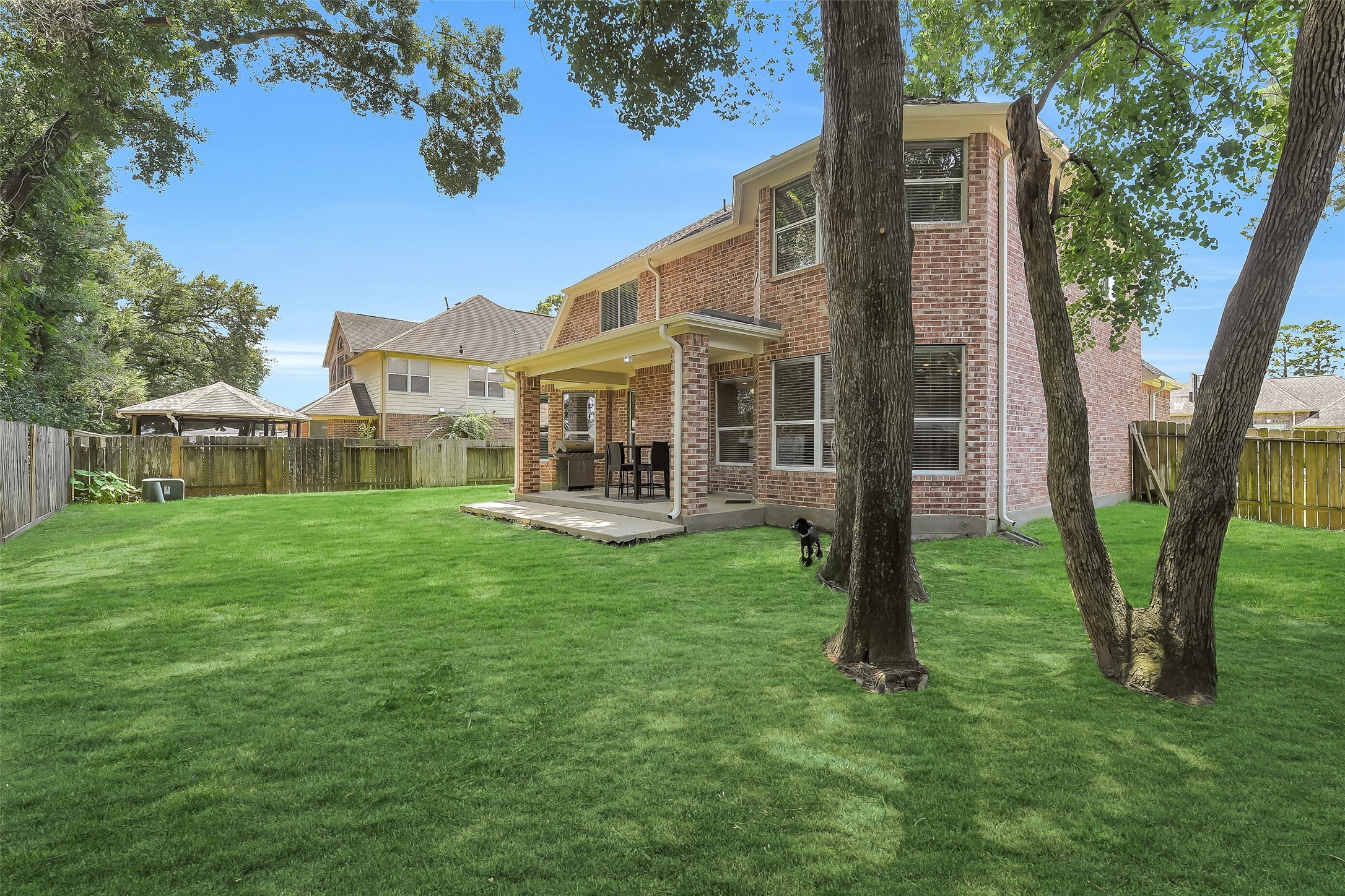 14906 Windsor Manor Houston, TX 77069 - Photo 30 of 34 Large backyard with plenty of green space & mature shade trees ~
