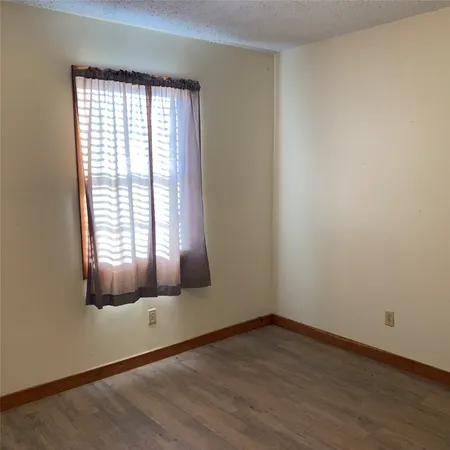 a bathroom with a shower curtain and a curtain
