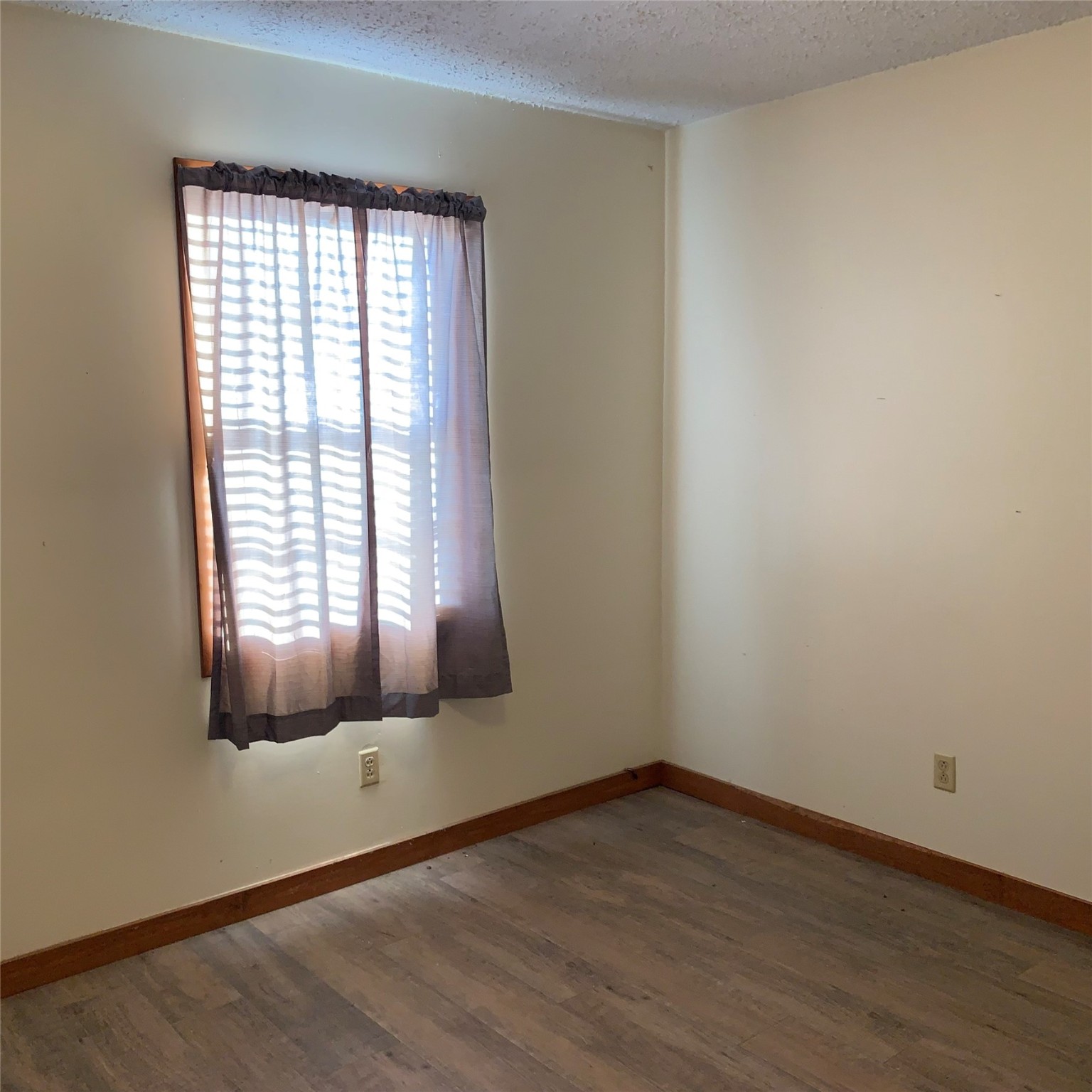 324 Persimmon Road Onalaska, TX 77360 - Photo 13 of 41 an empty room with wooden floor and windows