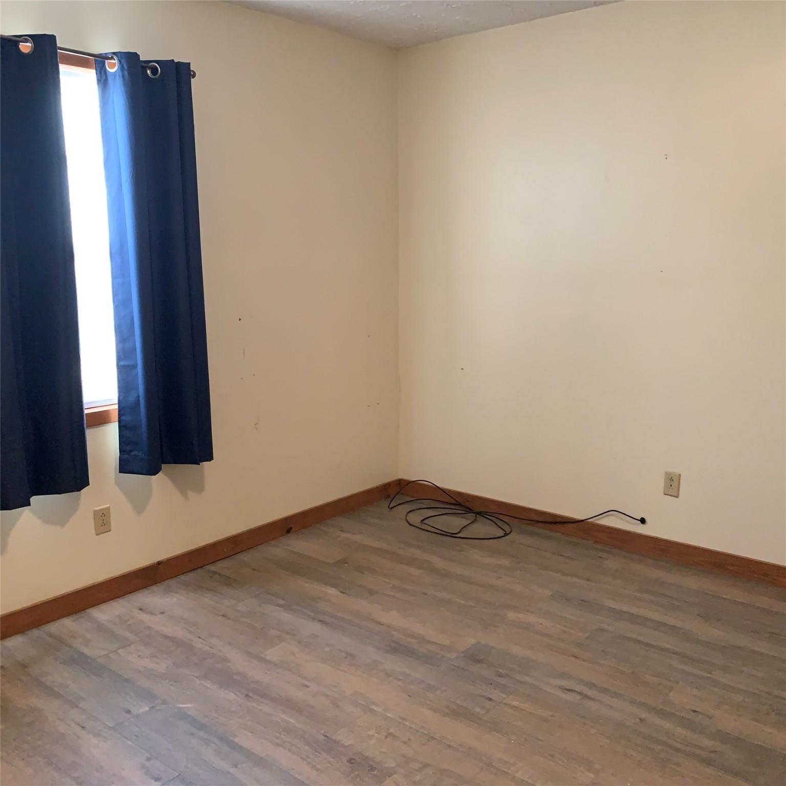 324 Persimmon Road Onalaska, TX 77360 - Photo 17 of 41 a view of an empty room with wooden floor and a window