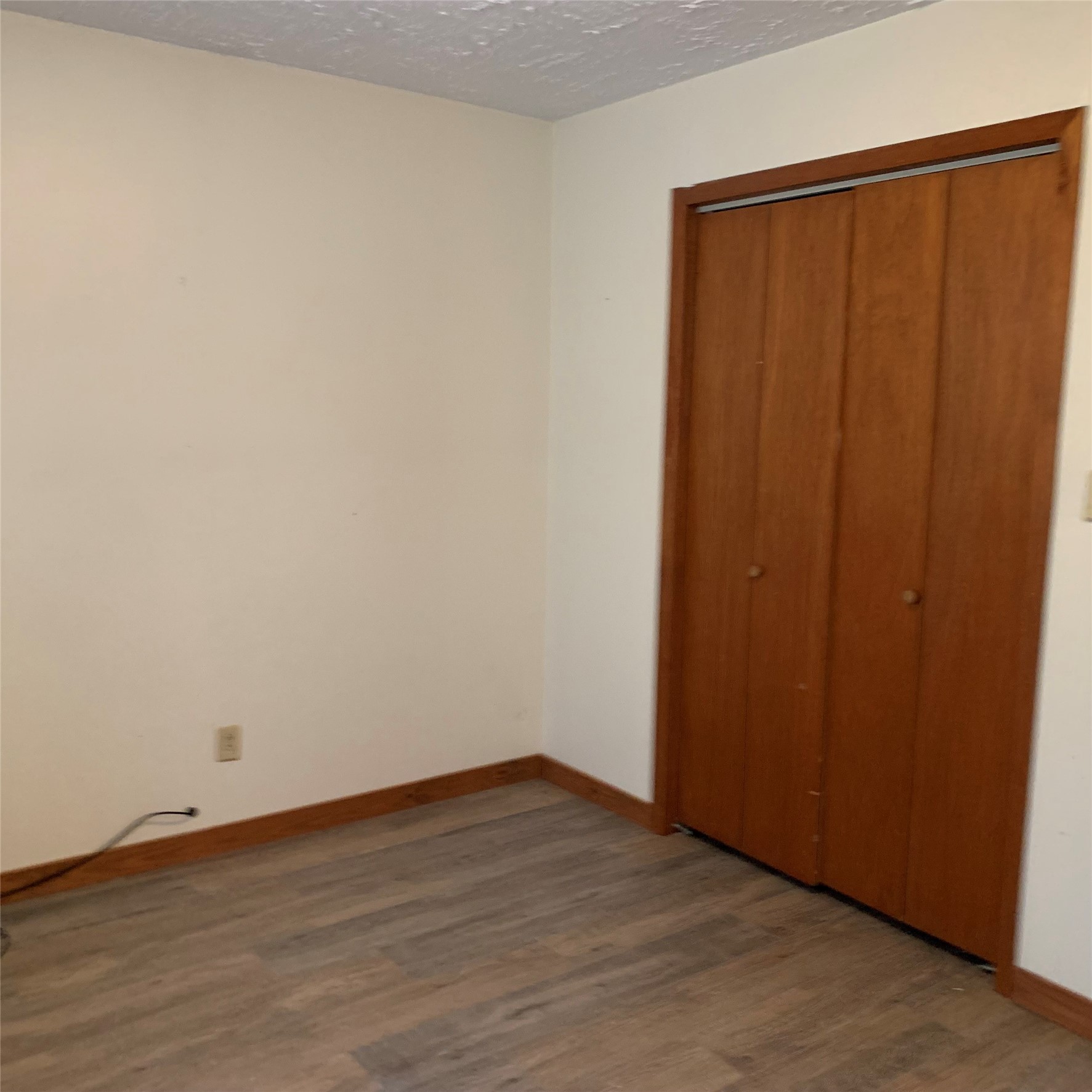 324 Persimmon Road Onalaska, TX 77360 - Photo 19 of 41 a view of an empty room with wooden floor