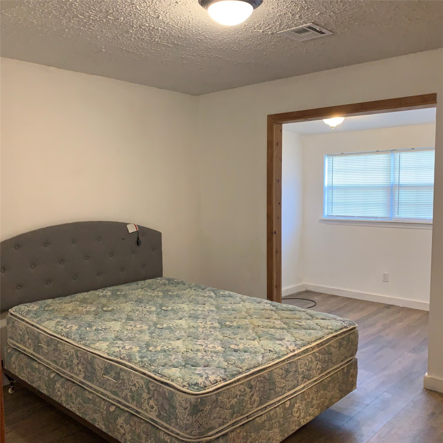 324 Persimmon Road Onalaska, TX 77360 - Photo 20 of 41 a bedroom with a bed and window