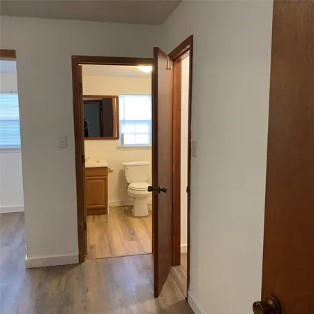 a bathroom with a shower a toilet and a shower