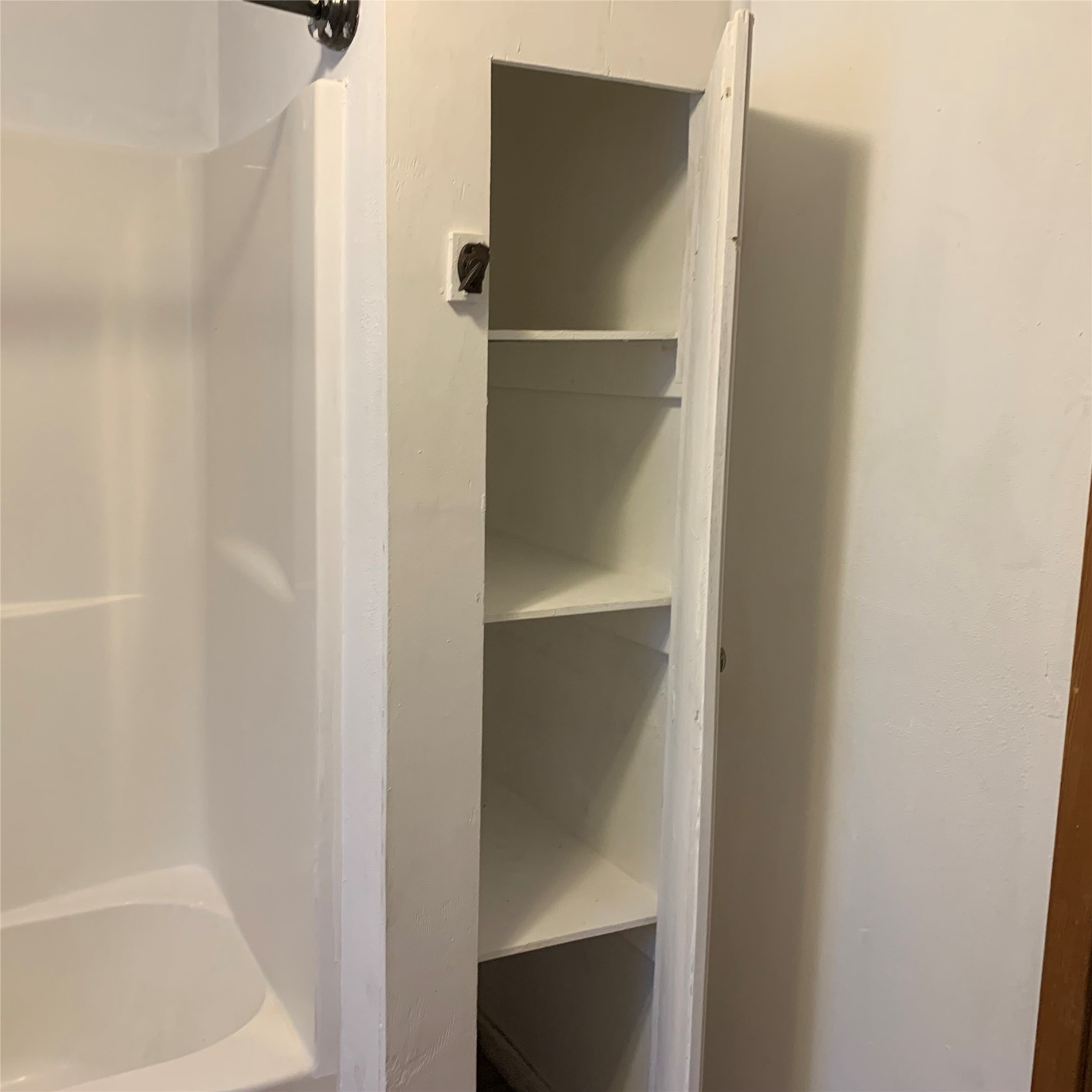 324 Persimmon Road Onalaska, TX 77360 - Photo 25 of 41 a bathroom with a glass shower door