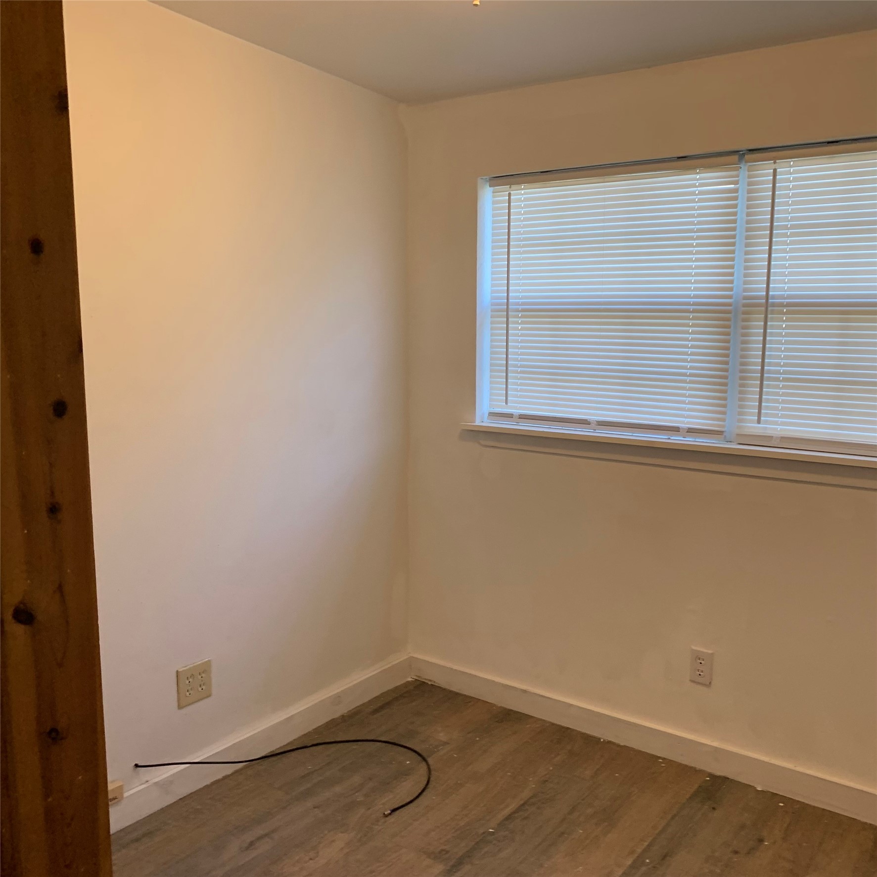 324 Persimmon Road Onalaska, TX 77360 - Photo 26 of 41 a view of a small space with wooden floor and a window