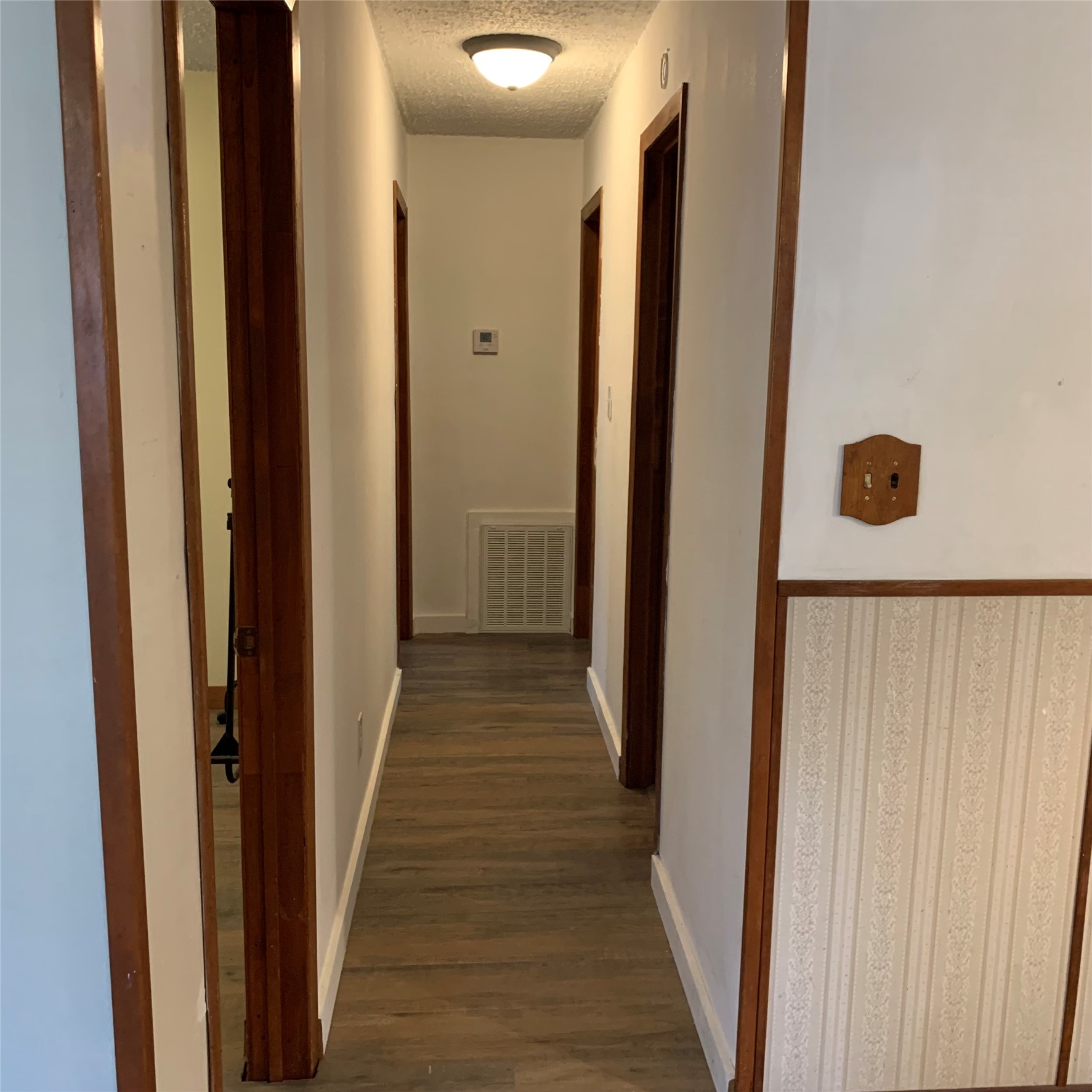 324 Persimmon Road Onalaska, TX 77360 - Photo 29 of 41 a view of a hallway with wooden floor