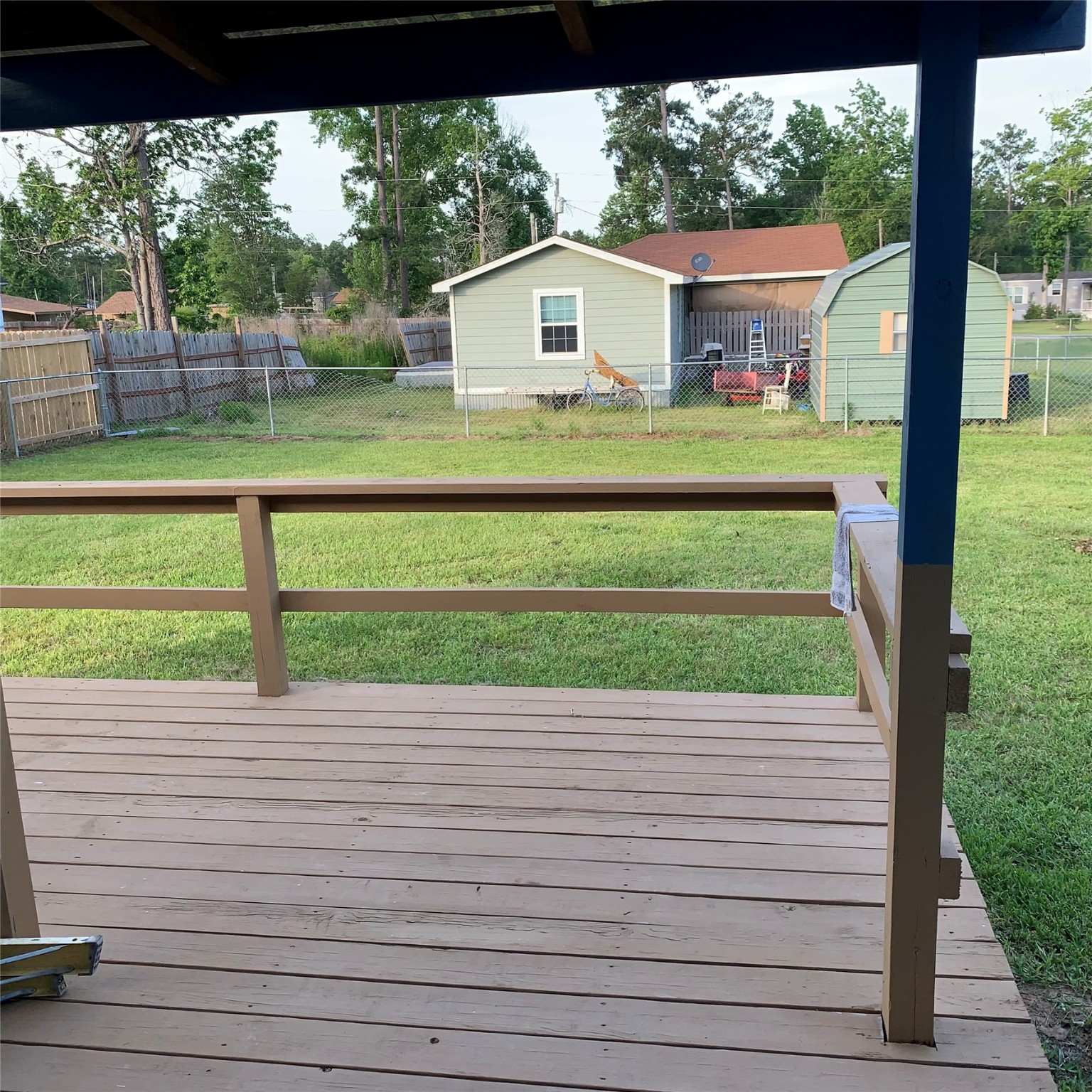 324 Persimmon Road Onalaska, TX 77360 - Photo 31 of 41 a front view of a house with a yard and garage