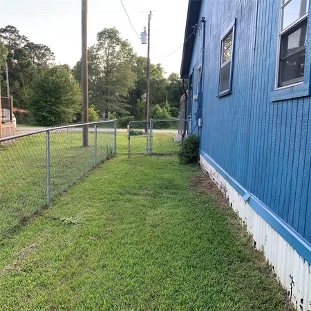 a view of a backyard of the house