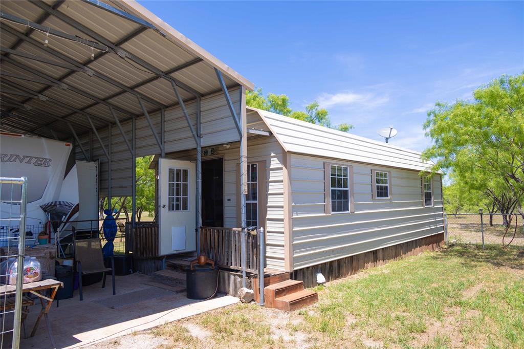 15905 County Road 211 Brookesmith, TX 76827 - Photo 13 of 23 a view of a house with a patio
