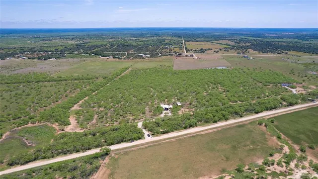 a view of a field with an outdoor space