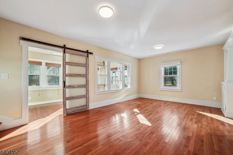 169 Diamond Spring Road Denville, NJ 07834 - Photo 16 of 31 an empty room with wooden floor and windows