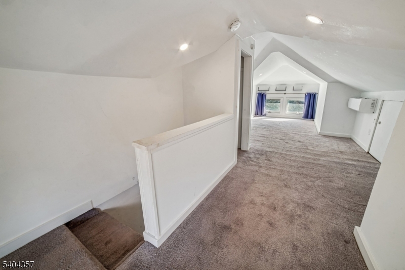169 Diamond Spring Road Denville, NJ 07834 - Photo 27 of 31 wooden floor in an empty room with a fireplace