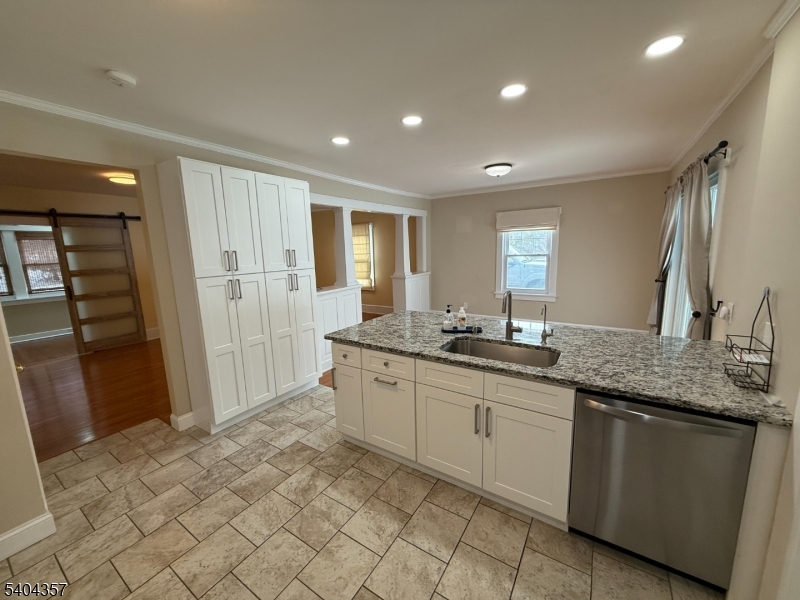 169 Diamond Spring Road Denville, NJ 07834 - Photo 10 of 31 a large bathroom with a granite countertop sink a toilet a mirror and shower