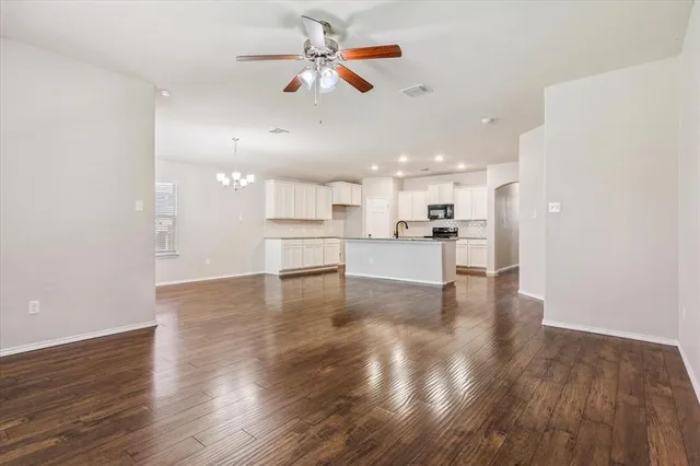 a view of kitchen with wooden floor and window