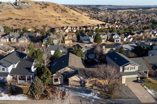 7790 Julynn Road Colorado Springs, CO 80919 - Photo 2 of 50 Aerial view of home, city and mountain views.