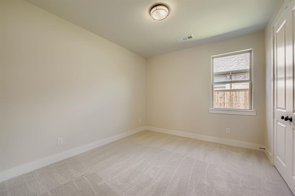 1809 Flowerfield Lane Mansfield, TX 76063 - Photo 23 of 29 Unfurnished room featuring light colored carpet and baseboards