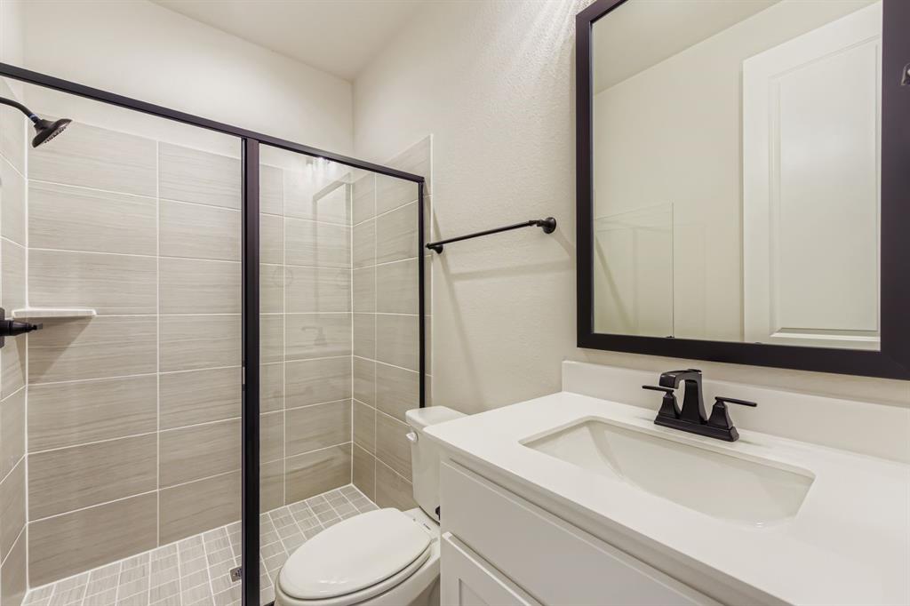 1809 Flowerfield Lane Mansfield, TX 76063 - Photo 24 of 29 Full bathroom with vanity and a stall shower