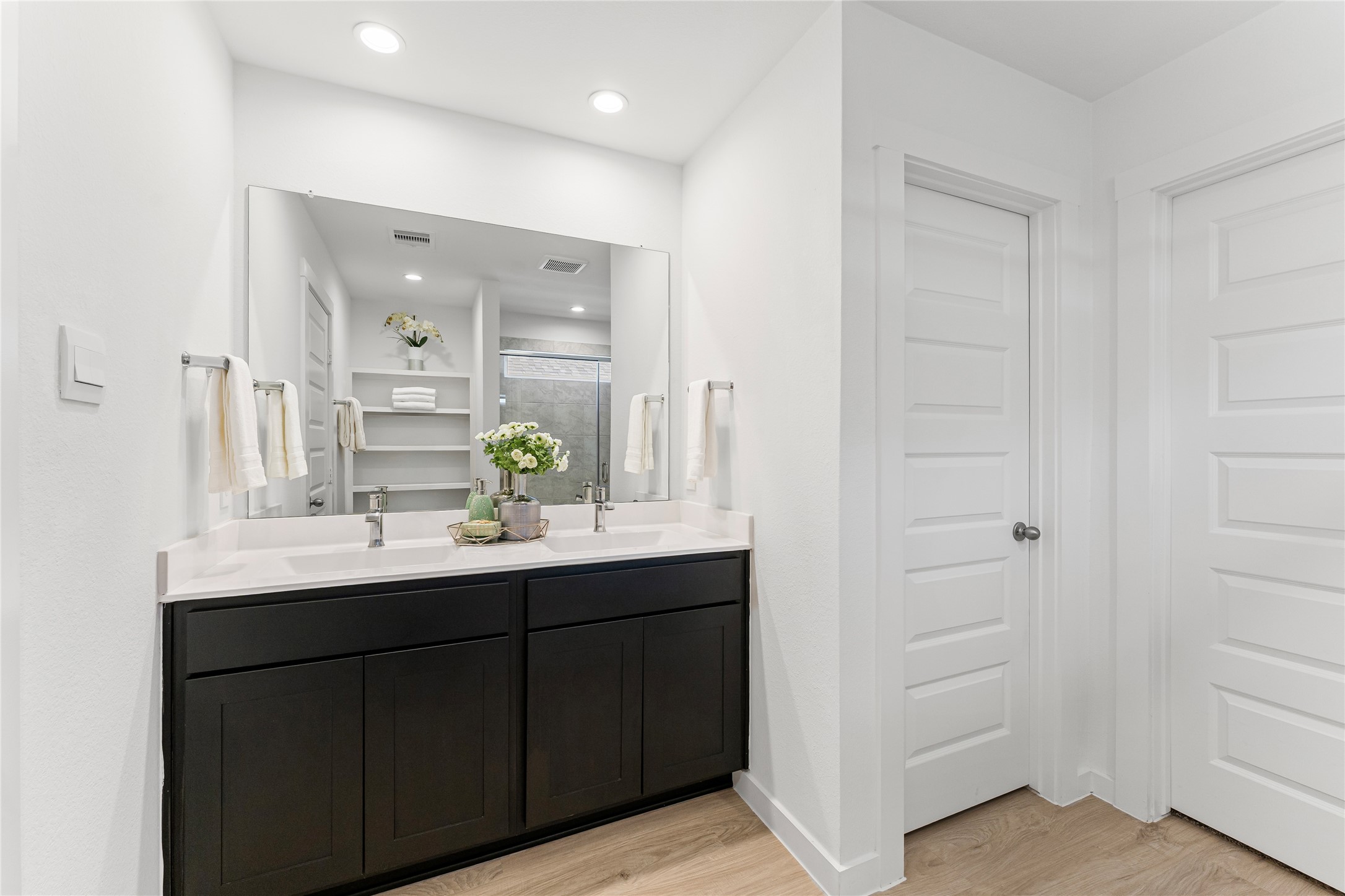 1214 Ricasoli Drive Richmond, TX 77406 - Photo 11 of 23 Indulge in this spa-like retreat featuring spacious double vanities that offer plenty of room for your morning and evening routines.