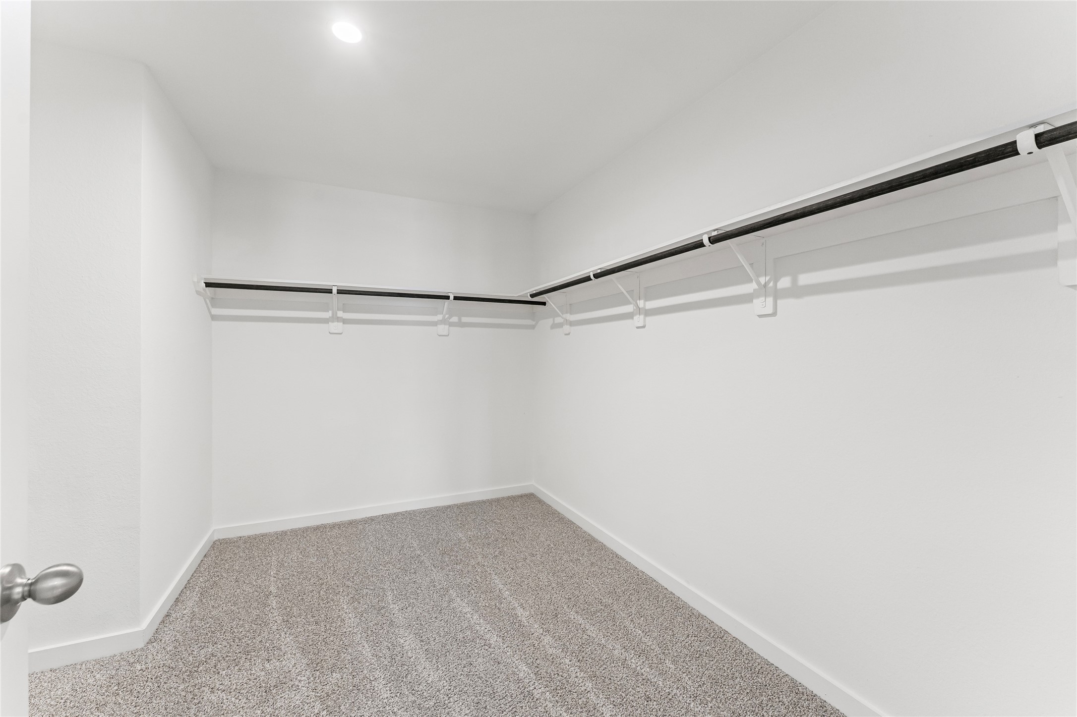 1214 Ricasoli Drive Richmond, TX 77406 - Photo 13 of 23 This impressive walk-in closet offers an incredible amount of storage space to keep your wardrobe perfectly organized and accessible.