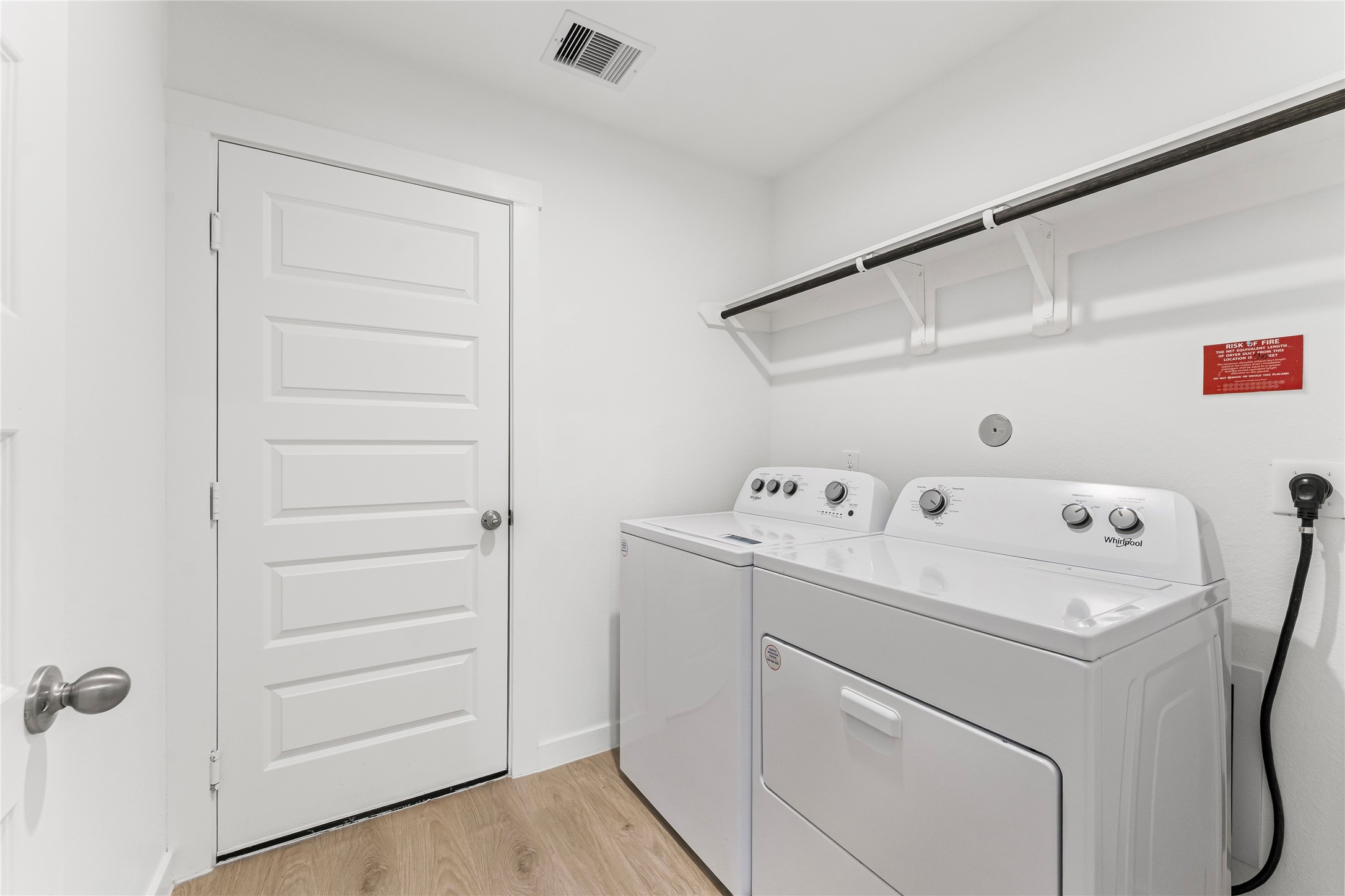 1214 Ricasoli Drive Richmond, TX 77406 - Photo 19 of 23 Conveniently located to make chores a breeze, this dedicated laundry space offers plenty of room for your modern appliances and storage needs.