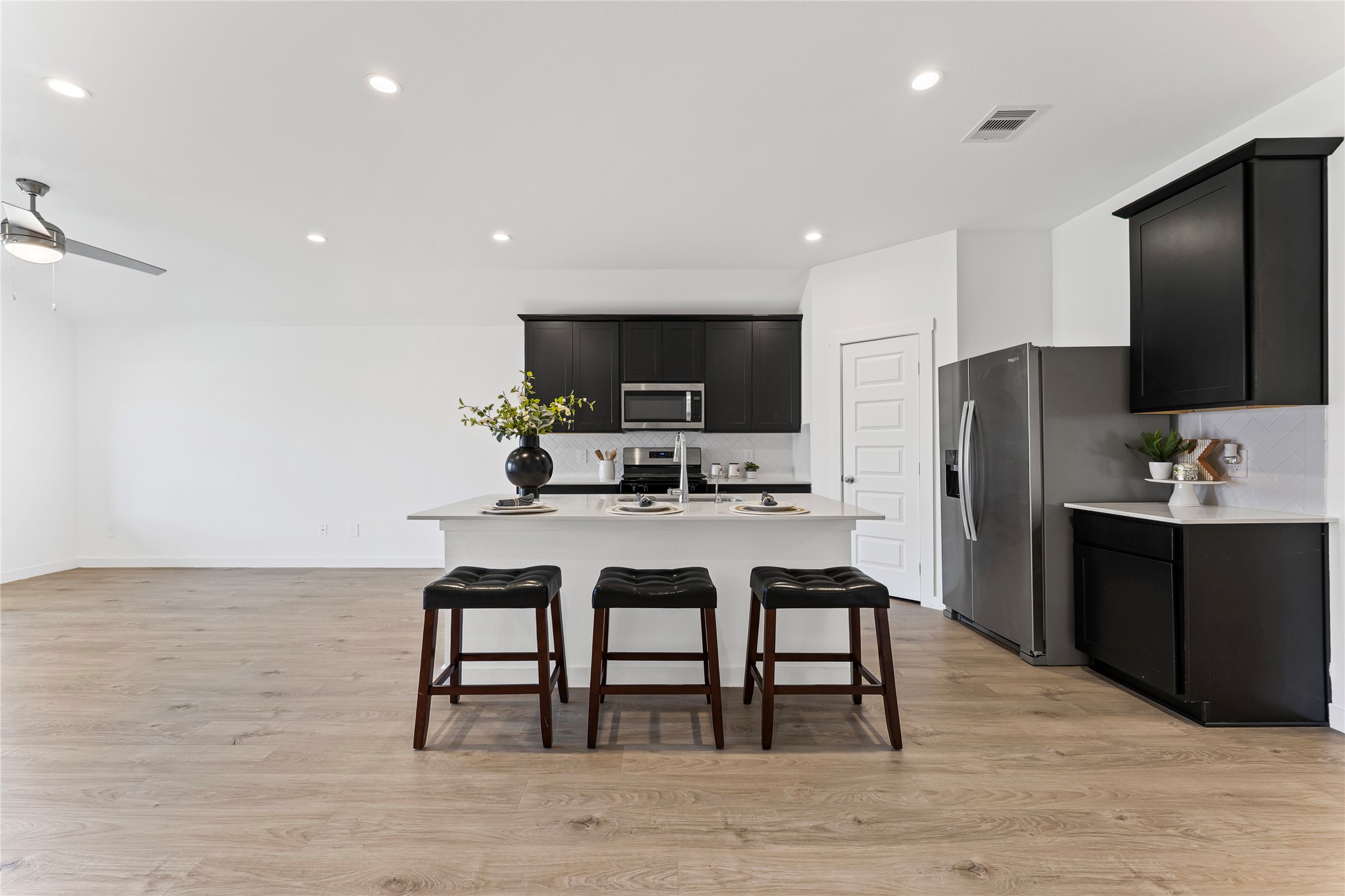 1214 Ricasoli Drive Richmond, TX 77406 - Photo 7 of 23 This chef’s dream features a massive center island that serves as the ultimate hub for meal prep and casual seating.