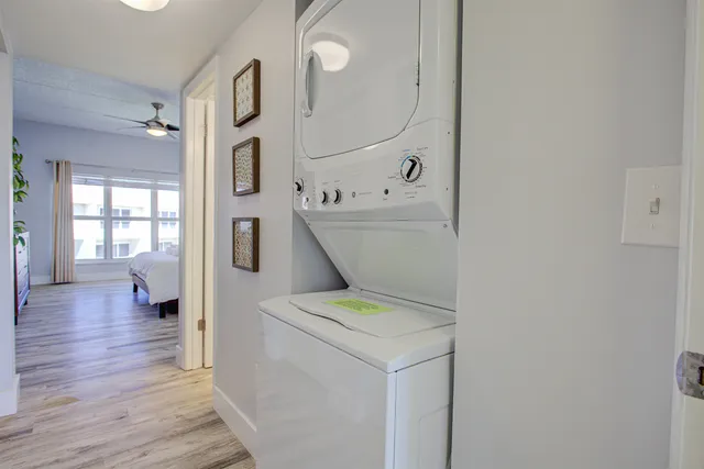 a view of living room with furniture and wooden floor