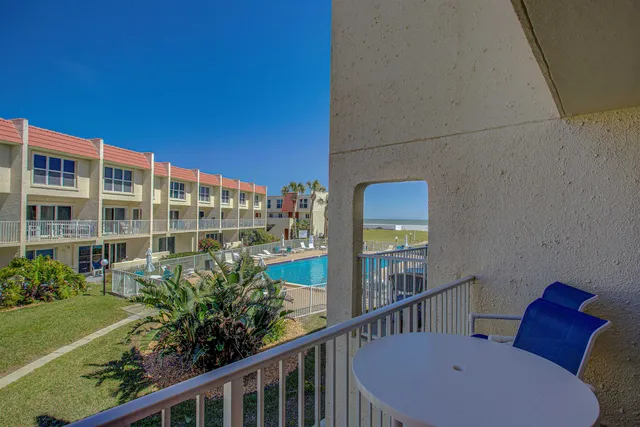 a view of a balcony with chairs