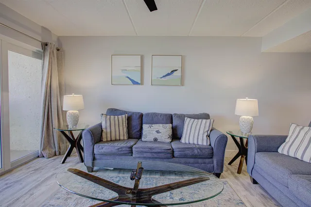 a living room with furniture and a lamp