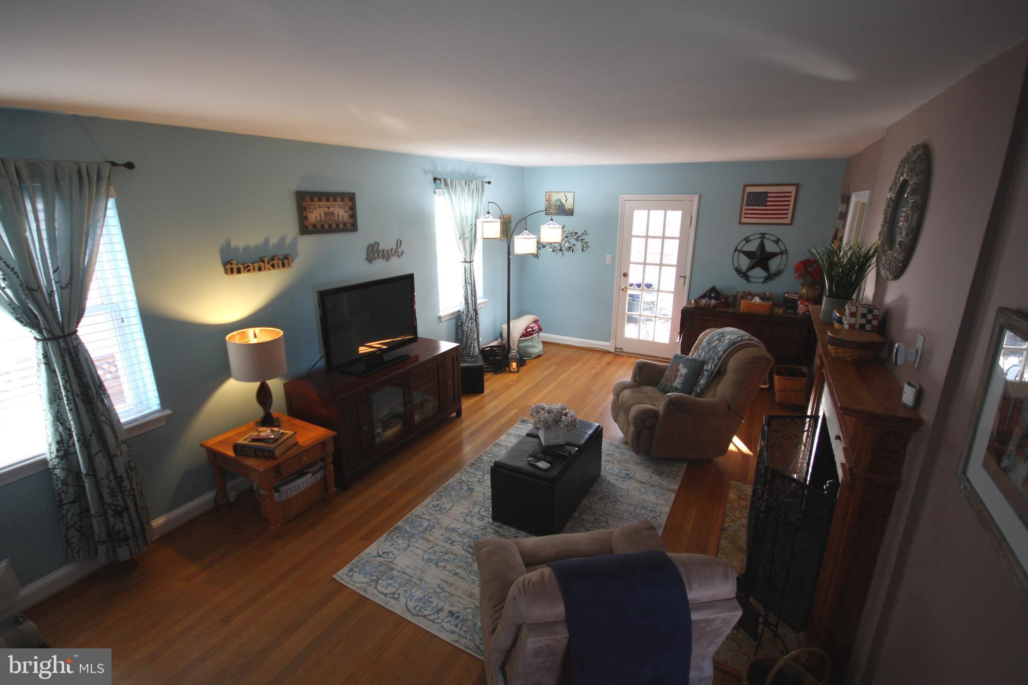 9506 Wire Avenue Silver Spring, MD 20901 - Photo 18 of 72 Living Room w Fireplace & Powder Room