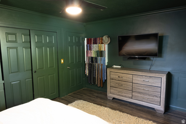 827 South 600 East Logan, UT 84321 - Photo 22 of 30 Interior space featuring wood-finish flooring, paneled walls, and a ceiling fan with integrated lighting