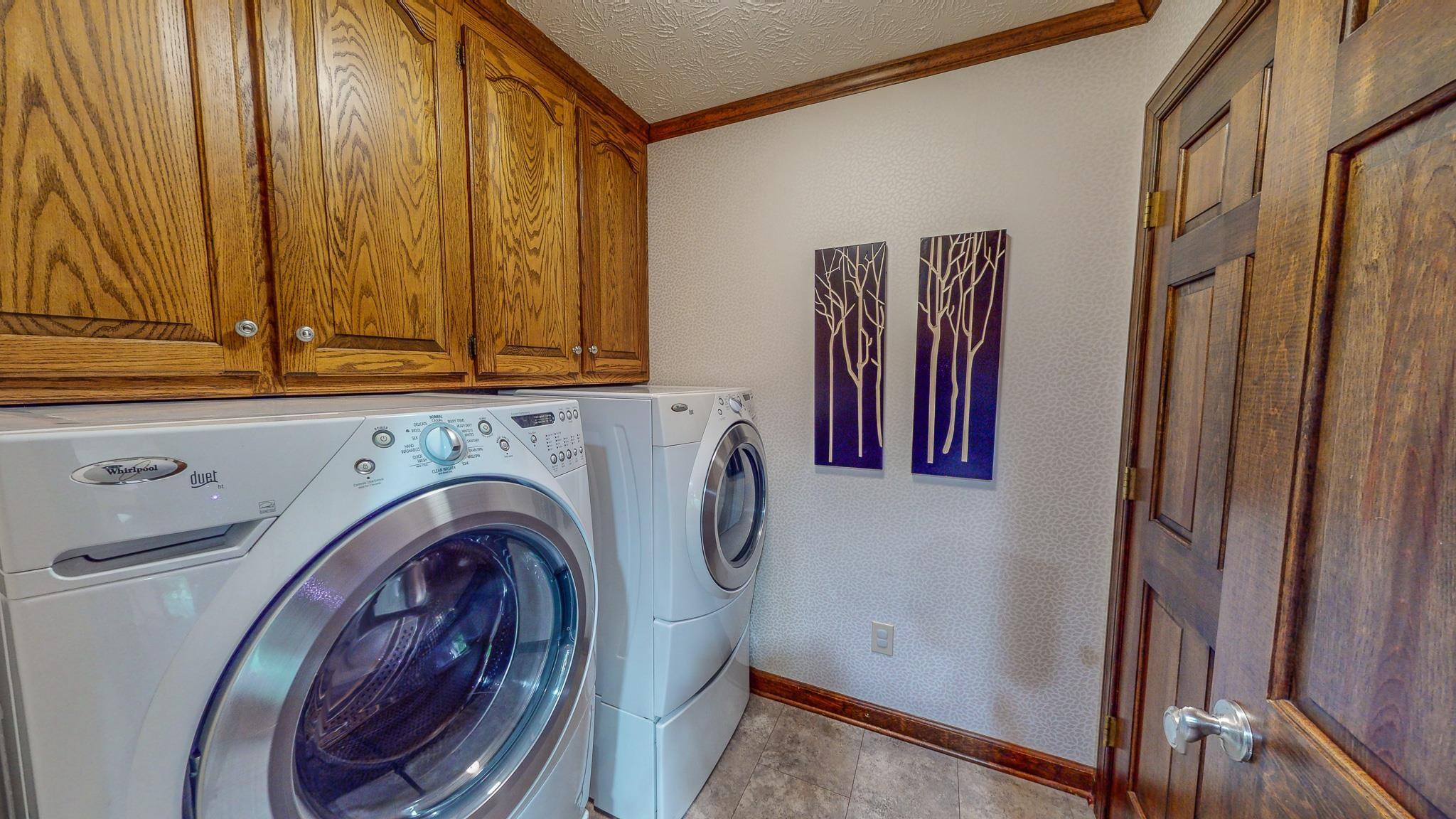 415 North Ridge Circle Roxboro, NC 27574 - Photo 21 of 59 a view of storage and utility room with washer and dryer