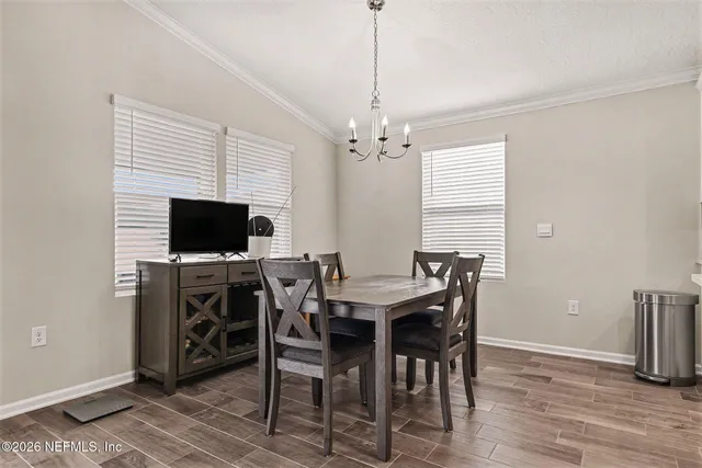 a kitchen with stainless steel appliances a stove a sink a microwave a refrigerator and cabinets